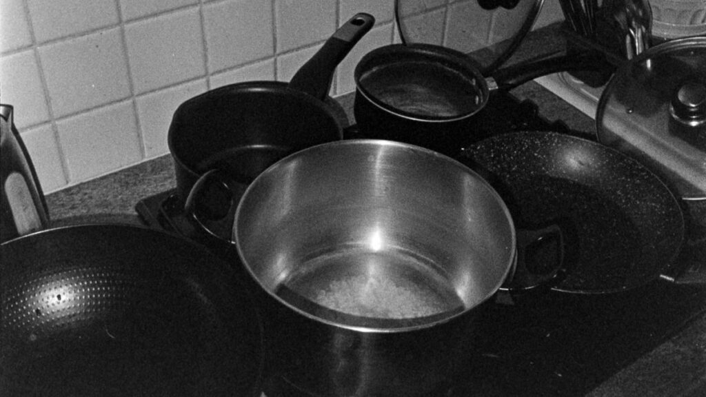 CAROTE 21-Piece Cookware Set: 7 Amazing Features to Consider 8 CAROTE 21-piece black nonstick cookware set with detachable handles, induction-compatible pots and pans for space-saving kitchen cooking, camping, RV, and travel.